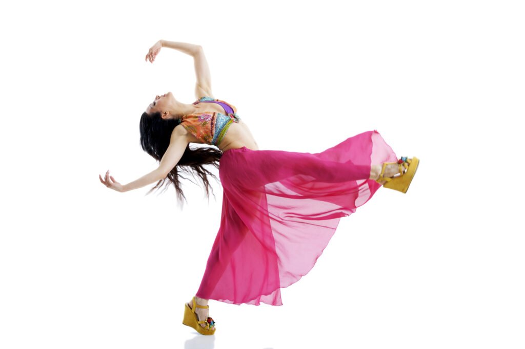 Woman dancing in flowy dress