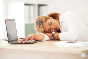 Burned out at work. Sleeping at desk.