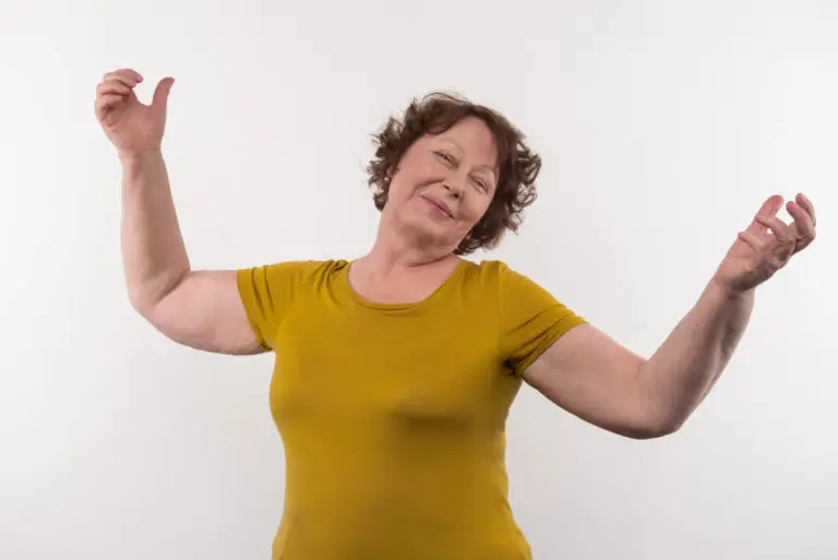 Woman exploring expressive movement and body awareness through somatic movement.